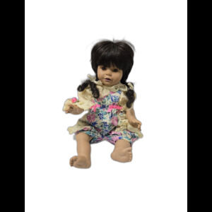 Vintage Collector's baby doll in floral outfit, brown hair